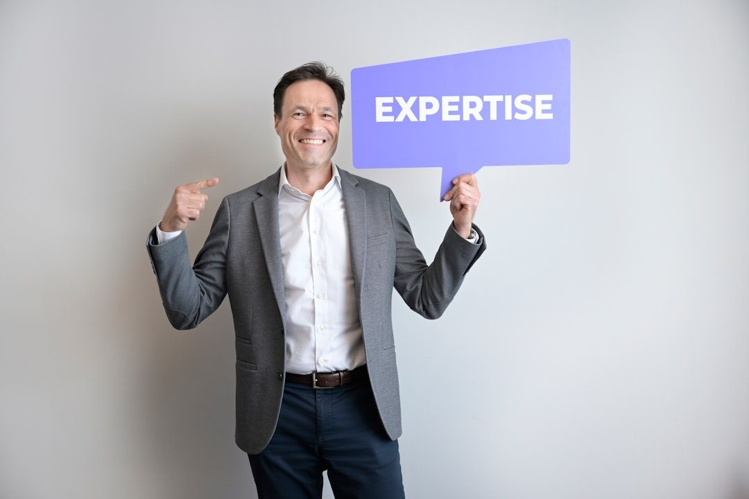 A man points to himself holding an "expertise" sign — aI-Powered Personalization at Scale